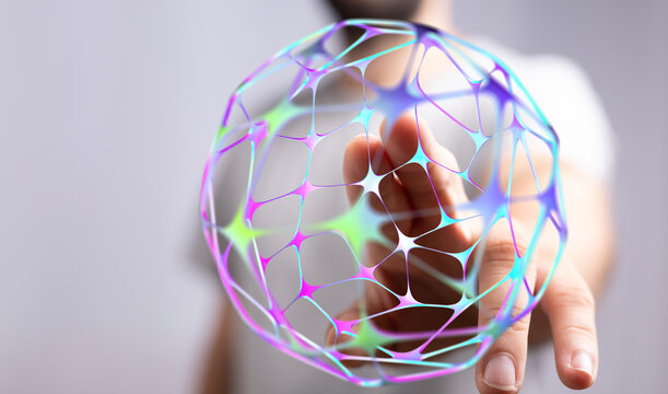 Close-up of a person's hand interacting with a glowing futuristic network sphere, concept of connection and technology.