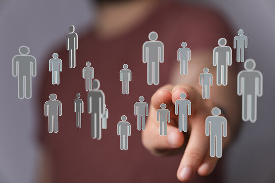 Hand pointing at connected people icons representing social media and business networks, perfect for teamwork a