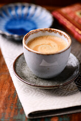 Cup of coffee on rustic wooden background. Soft focus. Copy space	