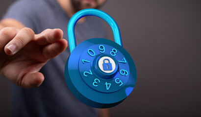 Close up shot of a digital blue lock held by a man emphasizing protection, security and privacy. Symbol of safe