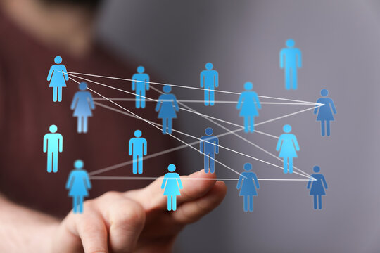 Hand reaching towards people icons in a digital network. Communication and connection concept. Technology for c