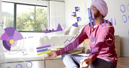 Man starting meditation in sunny bedroom, projecting expanding health data charts above hands - Powered by Adobe