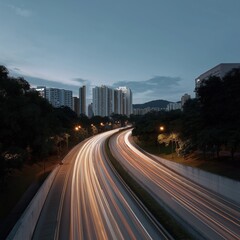 Obraz premium Urban nightscape with light trails of traffic on a city highway
