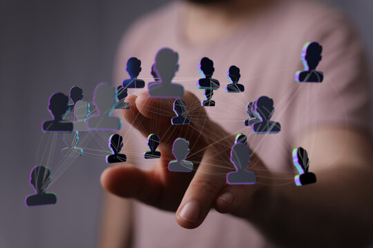 Concept of global connection, networking, and social media. Hand touching user icons. Representing interaction - Powered by Adobe