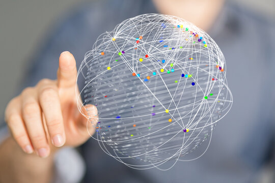 Person points at a digital globe, symbolizing global connectivity, communication, and technological advancement in a modern business