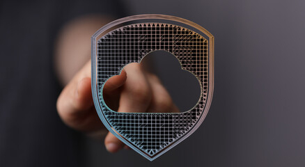 Abstract cloud security concept. Hand holding digital shield over cloud icon, representing data protection, cyb