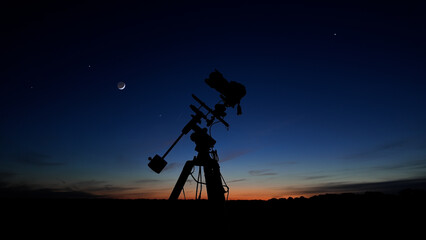Fototapeta premium Amateur astrophotography equipment with camera, tripod star-tracker for photographing stars, planets and Moon.