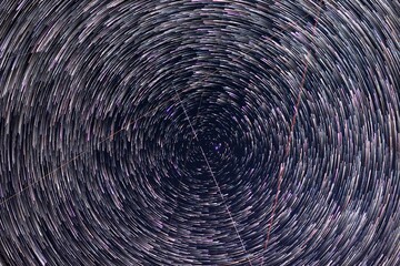 Milky way stars trails around north polar star.