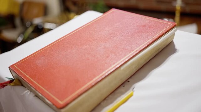 goldenedged pages with ribbon bookmark, close shot emphasizing texture and binding details of book