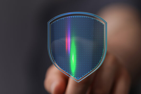Concept of data security and protection with a digital shield displayed, emphasizing cybersecurity, internet safety and privacy. High