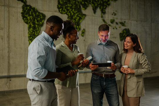 Diverse business team collaborating using digital tablet