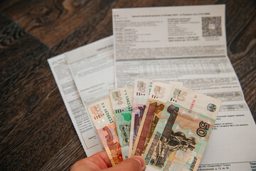 money is lying on utility bills