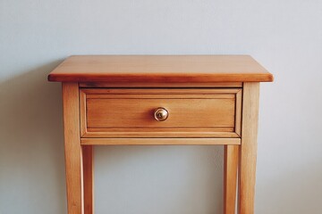 Stylish wooden table with single drawer, showcasing minimalist design and warm tones