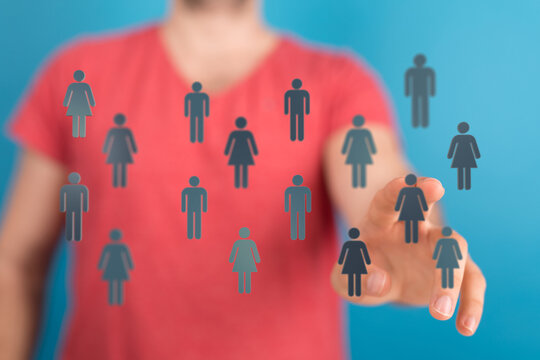 A person touching digital icons representing people, symbolizing collaboration and network.