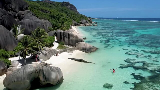 Luxury resort video of Seychelles tropical paradise 
islands in Indian Ocean with palm trees, sandy beach, 
granite stones. Beautiful 
coral reef, azure ocean, sky with clouds on horizon.