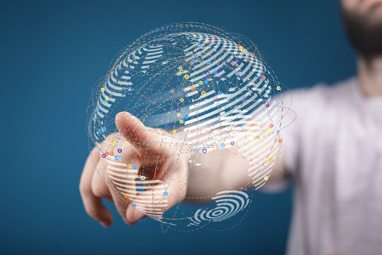 Person's finger interacting with a digital globe representing global connection, technology, and future concepts. Network of lines an