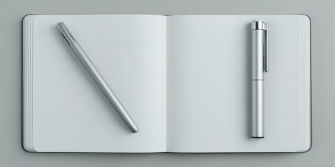 Stylish gray notebook with silver pens on a flat surface for creative writing or note-taking sessions