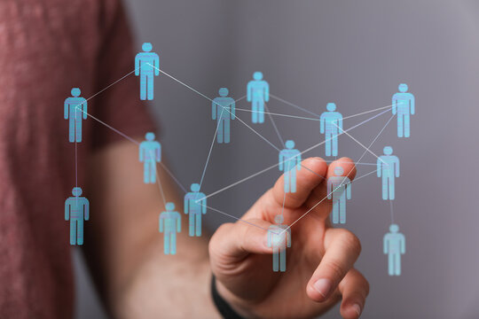 Concept of social network and global connections, shown with a person interacting with digital silhouettes, tea