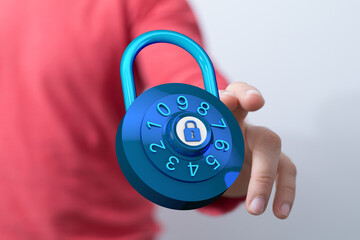 Close up photo of a person's hand holding a combination lock, representing security and protection....