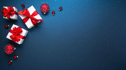 Merry Christmas and Happy Holidays greeting card, frame, banner. New Year. Noel. Red and white Christmas decorations and gifts on blue background top view. Winter xmas holiday celebration theme.