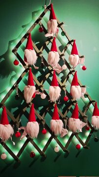 Video showcasing a creative Christmas wall decoration arranged in the shape of a tree