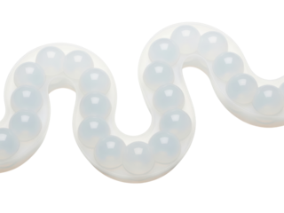Abstract wavy form holding many translucent gel spheres on a transparent background