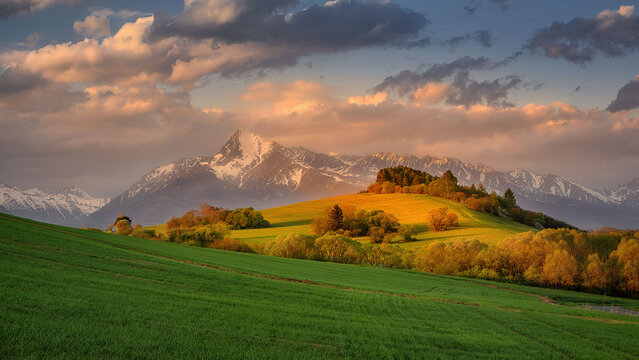 view of the High Tatras and Krivan in springtime at sunset