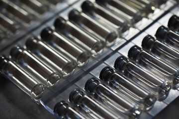 Close-Up of Empty Medical Vials in a Tray for Laboratory and Pharmaceutical Use