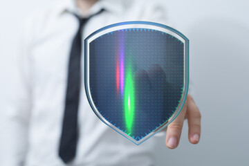 Concept of cybersecurity, data protection, and digital shield. Businessman with a digital shield representing security, protection, a