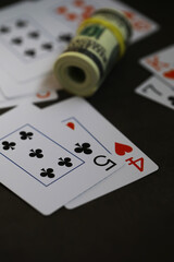 Close-Up of Playing Cards and Money on Dark Surface: Blackjack and Poker Concept for Risk and Strategy
