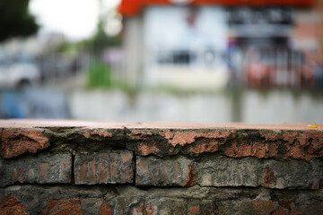 Rustic Brick Wall with Moss in Urban Street Setting
