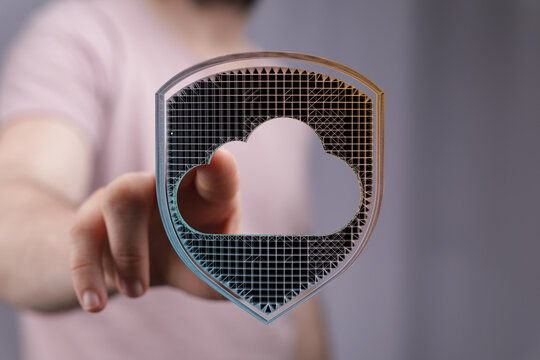 Hand touching cloud shield icon representing data protection security and safety in digital online storage.