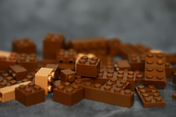 Scattered Brown Building Blocks on Dark Background: Creative Play and Construction Concept