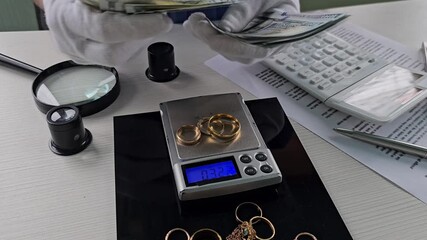 Weighing gold jewelry and counting cash at the local pawn shop with expert insights on valuing items