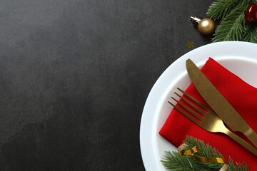 Top view of New Year table setting on dark background 
