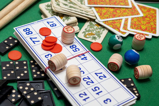 Collection of classic board games, scattered haphazardly on table, perfect for game nights and leisure time