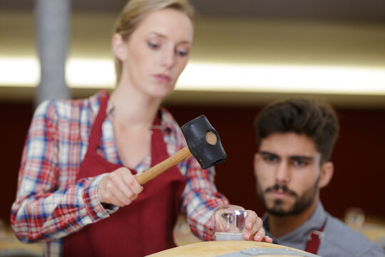 wood barrels production cooper using hammer in cellar - Powered by Adobe