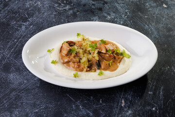 Creamy Mashed Potatoes With Chicken in Mushroom Sauce and Herb Garnish