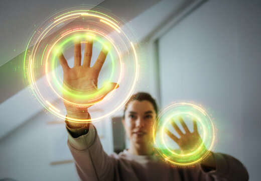 Young woman activating virtual biometric scanner with both hands
