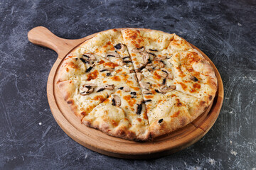 Gourmet Mushroom Cheese Pizza On Circular Wooden Board