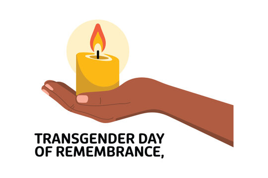 A hand holds a lit candle for Transgender Day of Remembrance.