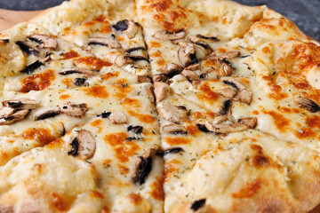 Gourmet Mushroom Cheese Pizza On Circular Wooden Board