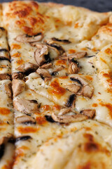 Gourmet Mushroom Cheese Pizza On Circular Wooden Board