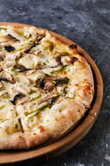 Gourmet Mushroom Cheese Pizza On Circular Wooden Board
