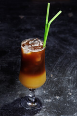 Iced Coffee Layered Drink in Glass with Green Straws