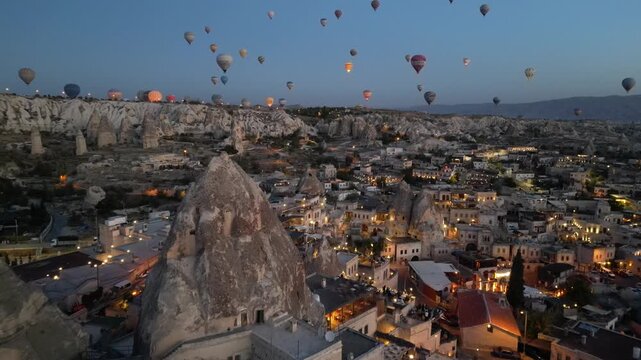Hot air balloons ascend over Cappadocia's unique landscape