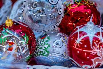 Close-up of colorful Christmas ornaments with intricate designs and details