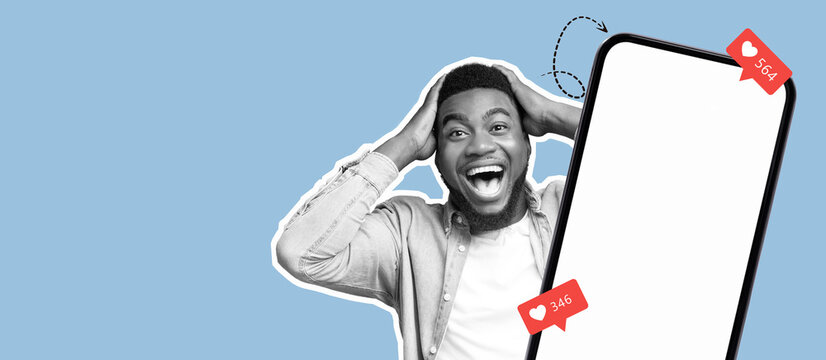 A young man expresses joy and surprise as he discovers high engagement on his social media post. He holds his head in excitement, highlighting the thrill of online interaction.