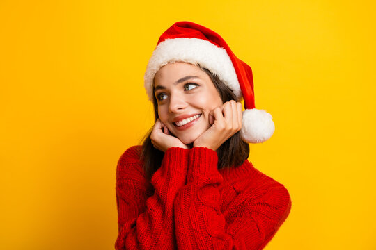 Cheerful santa hat moment with red sweater girl smiling dreamy holiday vibe capturing winter joy and festive charm