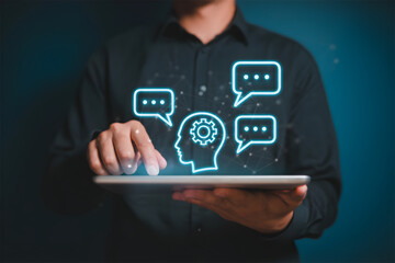 Man using tablet with glowing AI brain and chat icons for communication and artificial intelligence